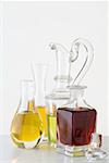 Various types of oil in carafes & bottle of balsamic vinegar