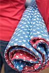 Woman holding picnic cloth (4th of July, USA)