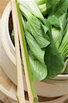 Pak choi in bamboo steamer (overhead view)