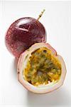 Purple passion fruits, whole and half