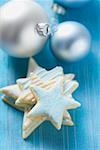 Iced star biscuits and silver Christmas tree baubles