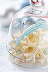 Assorted Christmas biscuits under glass dome