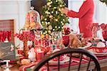 Christmas table, woman in background (USA)