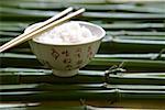 Rice in Asian bowl with chopsticks