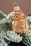 Christmas tree ornament: owl on snow-covered fir branch