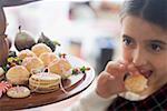 Girl eating profiterole (Christmas)