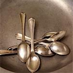 Silver Spoons on Round Silver Plate