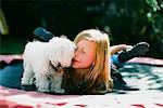 Girl with Dog on Trampoline, Costa Mesa, California, USA