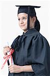 Young female graduate holding a diploma