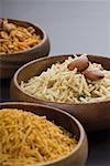 Close-up of various type of snacks in bowls