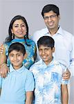 Portrait of a family posing and smiling