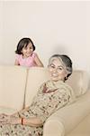 Portrait of a mature woman smiling with her granddaughter