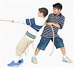 Two boys playing tug-of-war