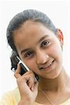 Portrait of a teenage girl talking on a mobile phone