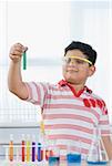 Boy holding a test tube
