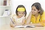 Young woman teaching her daughter