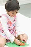 Close-up of a girl playing with puzzle