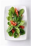 Spinach salad with tomatoes and pine nuts