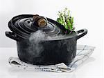 Cast iron casserole dish with steam