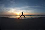 Man Jumping on Beach