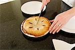 Woman Cutting Homemade Pie