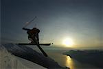 Jumping skier in front of sunset