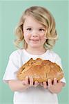 Girl holding bread