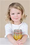 Girl with jar of lemon curd