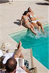 Family Hanging Out by Swimming Pool