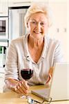 Portrait of Woman with Wine and Laptop Computer