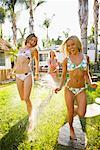 Woman Spraying Friends With Hose, Encinitas, San Diego County, California, USA