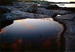 Leabgarrow, Arranmore Island, County Donegal, Ireland; Rocky coastline at sunset