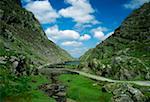 Gap of Dunloe, Killarney National Park, County Kerry, Ireland; Cyclists in the distance