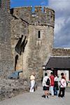 Cahir Castle, Cahir, County Tipperary, Ireland; Tourist group at 12th century castle