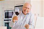 Portrait of Man Raising Glass of Wine