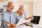 Couple Looking at Floor Plans