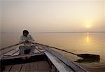 Man in Rowboat on Ganges River, Varanasi, India