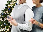 Couple at a Christmas Party, Woman Trying to Get Man's Attention