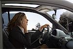 Woman Driving Car and Talking on Cell Phone