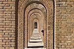 Boy Under Row of Arches, Fort Jefferson, Dry Tortugas National Park, Key West, Florida, USA