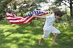 Boy Running With American Flag