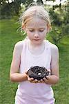 Portrait of Little Girl Holding a Bird's Nest With Egg, Elmvale, Ontario, Canada