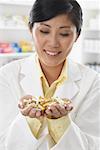 Portrait of Pharmacist With a Handful of Pills