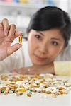 Portrait of Pharmacist Looking at a Pill