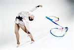 Female gymnast practicing with a ribbon