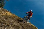 Mid adult man mountain biking