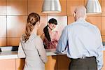 Rear view of business executives standing at a reception