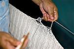 Mid section view of a man weaving Izamal, Yucatan, Mexico