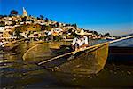 Fisherman with butterfly fishing net in a lake, Janitzio Island, Lake Patzcuaro, Patzcuaro, Michoacan State, Mexico