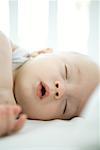 Baby sleeping with mouth open, close-up